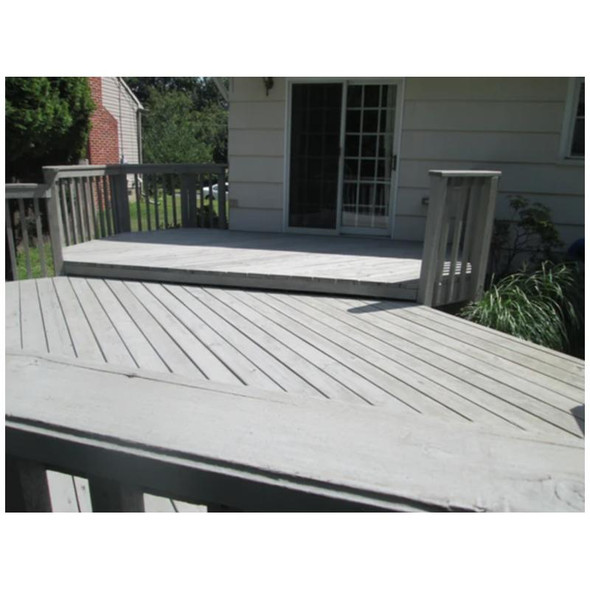 J.Racenstein Deck & Wood Stain Barnegat Gray Gallon DRP, wooden deck with grey stain finish beside a house with a sliding door.
