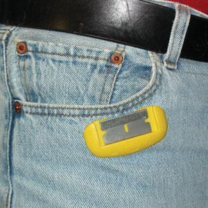 ProTool Holder Magnetic BladeLock, yellow magnetic tool holder clipped onto jeans pocket for secure blade storage