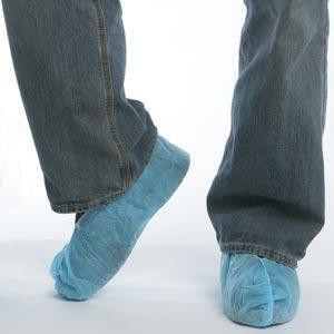 J.Racenstein Shoecover Skid Resistant, pair of blue skid-resistant shoe covers worn over regular shoes by a person standing on a smooth surface.