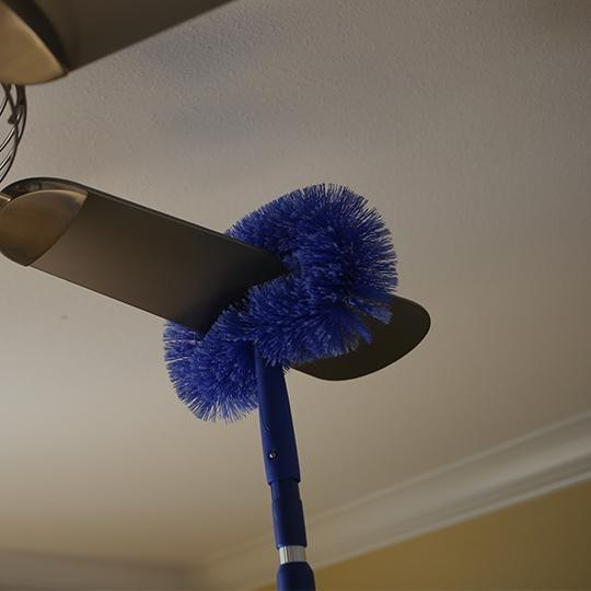 Ettore Ceiling Fan Brush with 54-inch pole, blue, used for cleaning ceiling fans.