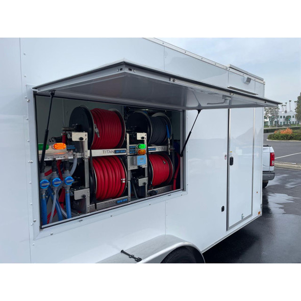 ProTool Enclosed Pressure and Soft Washing Drone Trailer, a white mobile trailer with an open compartment showing red and black hoses, pressure washers, and related equipment for drone-based power washing services.