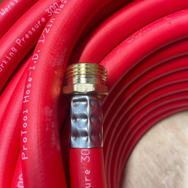 ProTool Ultra Light Hybrid Hose 300 PSI, close-up of a red flexible hose with a brass fitting and metal connector, suitable for high-pressure air or fluid transfer.