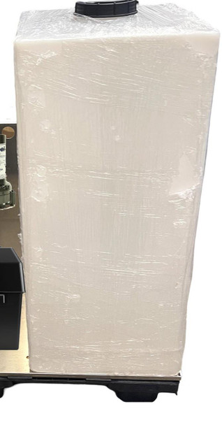 ProTool Dual User Pure Water Mini Skid, large white water filtration system wrapped in plastic with black top and base.