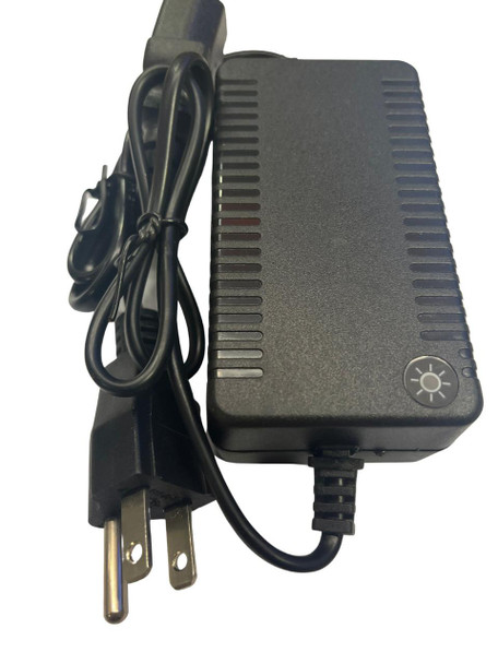 J.Racenstein Gardiner Backpack Charger, black power adapter with a power cord and indicator light on the side.