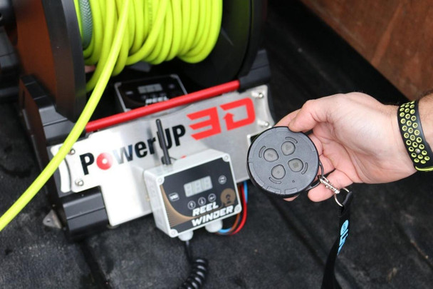 Spring Controller, Reel Rewinder Remote Link, handheld remote control device for operating a reel rewinder system.