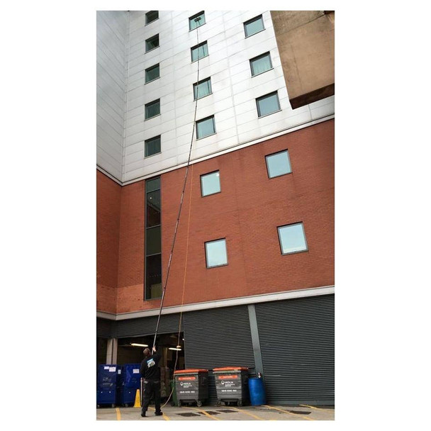 Gardiner Pole Systems Gardiner X3 Xtreme 80ft High Modulus Carbon Pole, used for exterior building maintenance or window cleaning on high-rise structures.