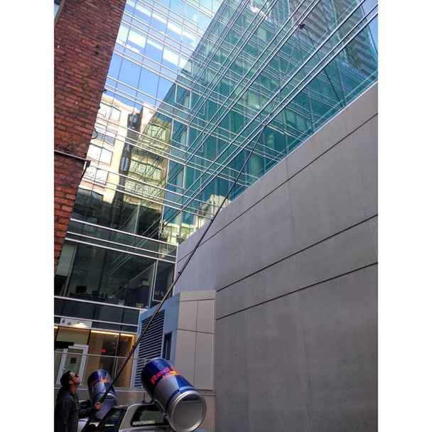 Gardiner Pole Systems Gardiner X3 Xtreme 80ft High Modulus Carbon Pole, long carbon pole reaching high up the building exterior for maintenance or cleaning.