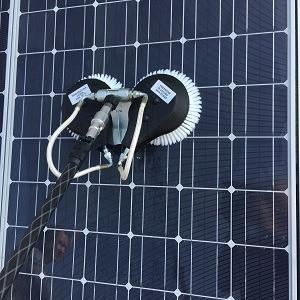 J.Racenstein Gardiner Washing Adaptor 1/4in NPTF x 1/4in NPTF, installed on a solar panel for water cleaning