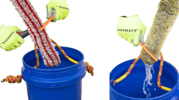 ProTool Bucket Buddy Washer Sleeve Wring Out Tool, demonstrating removal of a wet mop sleeve from a bucket, with hands wearing bright yellow gloves holding the tool.