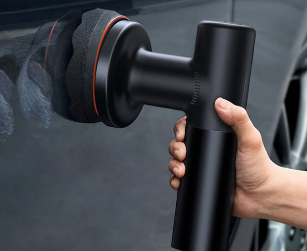 ProTool Wireless Speed Polisher Portable, person holding a black cordless portable polishing tool with a foam-mounted polishing pad in use.