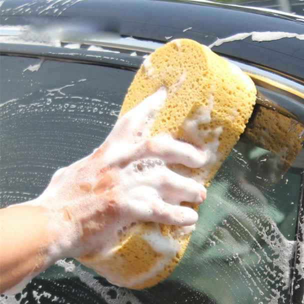 ProTool Sponge Washing Extra Large, person cleaning a car with a large yellow sponge and soap suds.