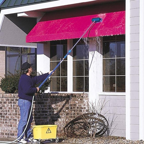 J.Racenstein Pole HydraSoar FloThru 12ft, person cleaning a building's exterior window with a long pole and water spray system.