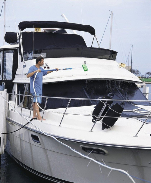 J.Racenstein Brush Bi-Level 10in Green Very Soft, the image shows a man cleaning a white yacht with a long-handled green cleaning brush.