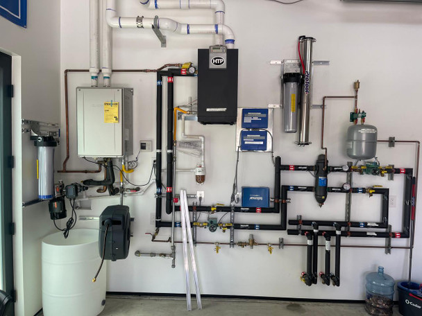ProTool Wall Mount RODI Garage Wash, installed on a garage wall with various pipes and filtration systems.