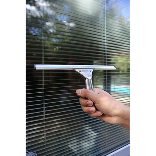 Ettore Classic Squeegees, hand using a squeegee to clean window blinds.