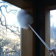 Ettore Lambswool Duster with Threaded Handle, white fluffy duster cleaning window blinds.