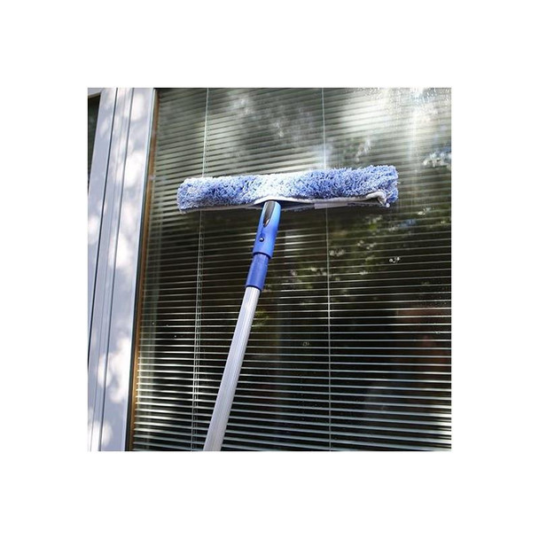Ettore ProGrip Washers, image of a window cleaning mop with a blue and white microfiber pad being used on a glass window.