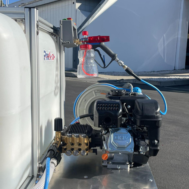 ProTool Auto Detailing Skid, a mobile car detailing equipment with a gas engine, water tank, hoses, and spray gun for cleaning vehicles.