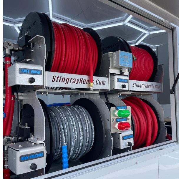 ProTool Enclosed Pressure and Soft Washing Drone Trailer, organized storage with red and black hoses, gauges, and control switches for pressure and water flow management.