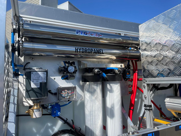ProTool Drone Pressure Washing Flatbed Skid, industrial equipment with hydraulic and pressure washing components mounted on a flatbed