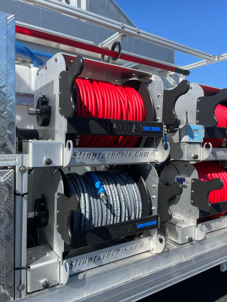ProTool Drone Pressure Washing Flatbed Skid, mounted with coiled pressure hoses and related equipment, designed for industrial pressure washing operations.