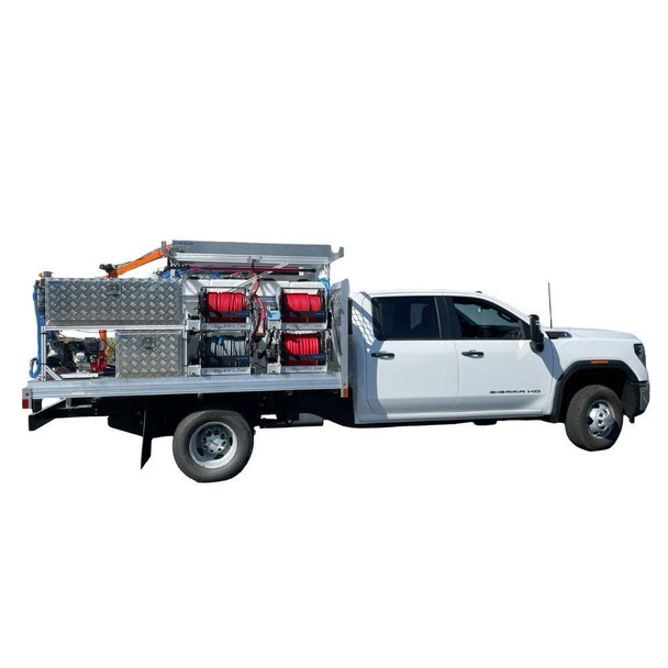ProTool Drone Flatbed Skid - V-SPEC, white service truck fitted with an aluminum flatbed skid, diamond-plate toolboxes, hose reels, and mounted equipment.