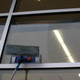 J.Racenstein Butterfly Kit - Ettore, window cleaning demonstration with a mop cleaning the glass surface.