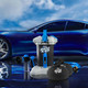 Unger Rinse & Go System Unger, portable car wash system with bottles, hose, and accessories, displayed in front of a sleek blue sports car.