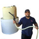 ProTool Sodium Hypochlorite (SH) 12.5 per gallon, person holding a spraying nozzle connected to a large yellow storage tank in NJ warehouse.