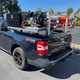 ProTool Ultimate Solar Skid, a portable solar power system mounted on the bed of a black Ford Maverick pickup truck.