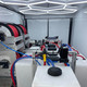 ProTool Enclosed Pressure and Soft Washing Drone Trailer, interior view showing pressure washing equipment, hoses, and control systems inside a white enclosed trailer.
