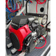 ProTool Enclosed Pressure and Soft Washing Drone Trailer, detailed view of the industrial pressure washer engine and equipment mounted on a durable trailer frame.