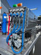 ProTool Drone Pressure Washing Flatbed Skid, industrial cleaning equipment with water, chem, soap control valves, and pressure washing components on a flatbed trailer.