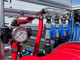 ProTool House Wash & Window Cleaning Skid, industrial cleaning equipment with red and blue hoses, gauges, and connectors for property maintenance.
