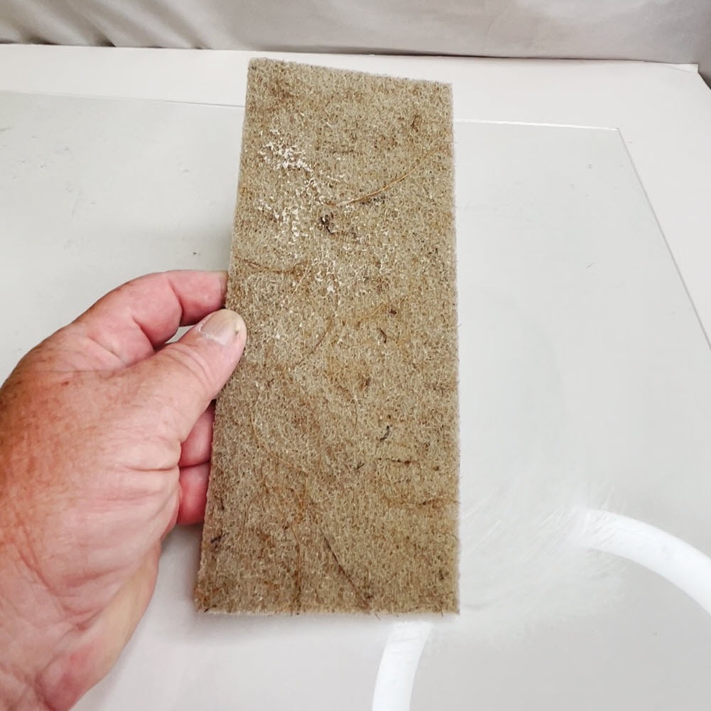 coconut-husk-scrub-pad-hard-water-removal-4-x10-in-hand-26-09.jpg
