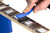 Music Nomad F-ONE Unfinished Fretboard Care Kit brush in action