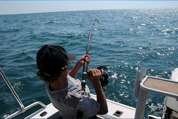 An angler reeling a fish