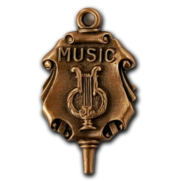 A bronze cast scroll graduation charm for music