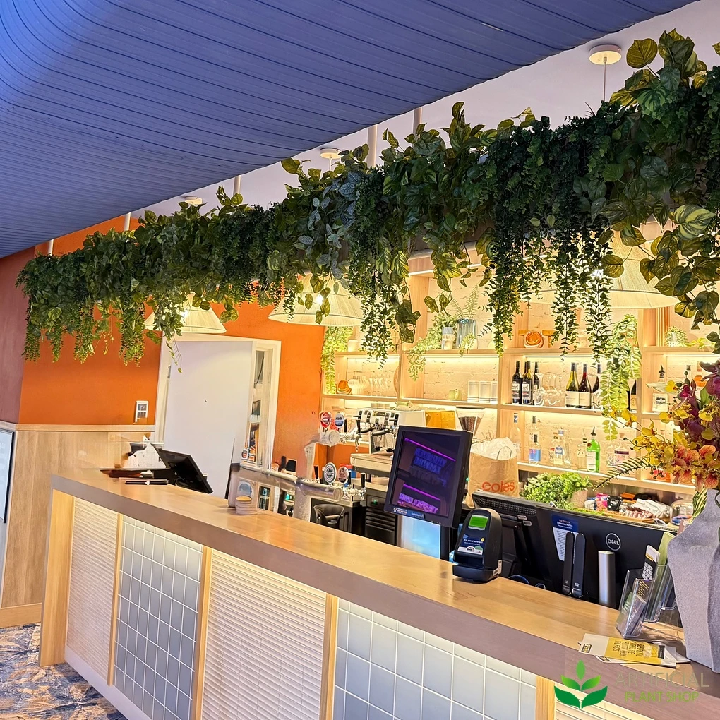 artificial greenery kits fitted above a shopfront entrance