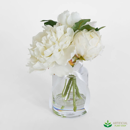artificial peony flower arrangement in a glass vase