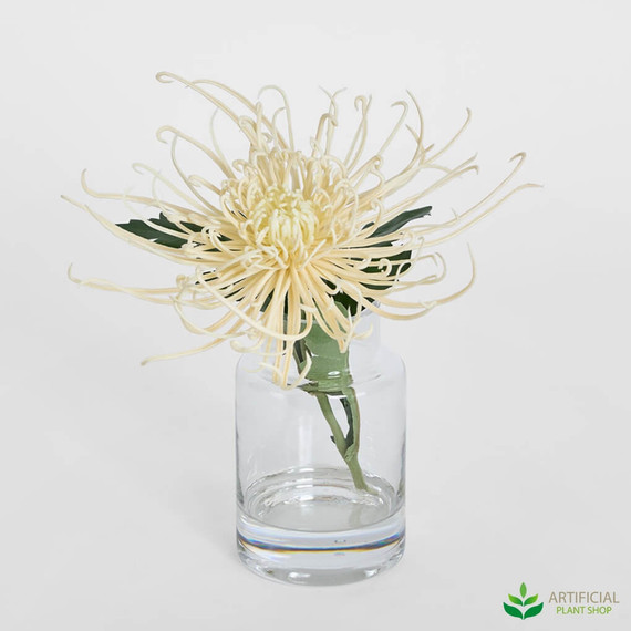 artificial spider flower in a glass vase