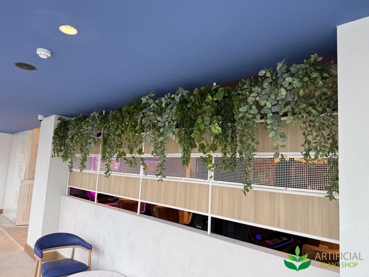 venue lounge after fake hanging greenery kits were installed along the partition
