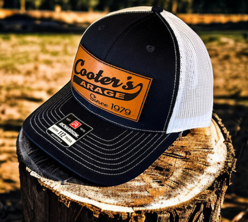 Cooter’s Garage Swoosh Leather Patch Trucker Hat
