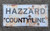Rustic Hazzard County Line Sign w/Bullet Holes 12x24
