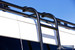 Aluminess side ladder clamped to the Aluminess roof rack on a Transit