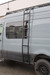 Rear quarter of a Sprinter with the Tec Vanlife side ladder