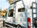 WTA side ladder on a white Ford Transit, front three-quarter view