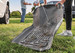 Hosing dirt and grass off a WeatherBeater floor liner outdoors