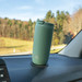 Sage Silwy thermo cup on its pad on a car dashboard
