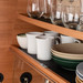Silwy mugs standing on pads inside a camper cupboard